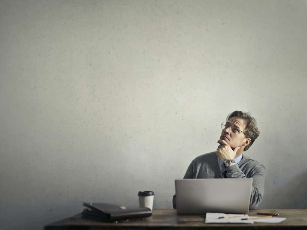 photo of a man using laptop