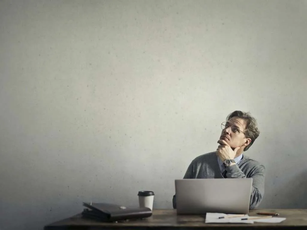 photo of a man using laptop