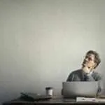 photo of a man using laptop