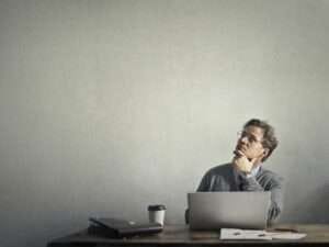 photo of a man using laptop