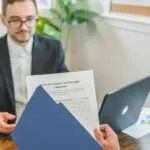 a person holding loan documents