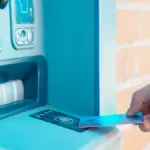 81% of Your Debit Card Swipes Are Still ATM Withdrawals — Here's Why That's Costing You More Than You Think There's a quiet financial habit draining millions of Indian households every single month, and most people don't even realize it's happening. You walk up to an ATM, punch in your PIN, pull out ₹5,000 in crisp notes, and go about your day. It feels normal. It feels safe. It feels like you're in control of your money. But here's what no one tells you at the ATM screen: that single withdrawal might be the most expensive transaction you make all week — not because of the fee you see, but because of the dozens of costs you don't. Reserve Bank of India data and multiple fintech research studies consistently show that a staggering 81% of debit card usage in India still occurs at ATMs in the form of cash withdrawals, rather than as point-of-sale (POS) or digital payments. In a country that launched one of the world's most ambitious digital payment revolutions through UPI and RuPay, that number is both remarkable and deeply revealing. It tells us that despite the infrastructure, despite the convenience, and despite years of financial literacy campaigns, the cash habit hasn't just survived — it's thriving. This isn't a judgment. This is a forensic look at what that habit is actually costing you, your household, and your financial future. The Visible Cost: ATM Fees You're Paying Without Thinking Let's start with the obvious. Every Indian bank allows a limited number of free ATM transactions per month — typically five at your own bank's ATMs and three at other bank ATMs in metro cities. Beyond that, you're charged ₹21 per transaction (as per current RBI-mandated caps), and that's before GST is added on top. If you're someone who visits the ATM eight to ten times a month — which is entirely common for salaried individuals managing household expenses — you could easily rack up ₹100 to ₹200 in direct ATM fees every month. That's ₹1,200 to ₹2,400 per year, just in transaction charges. Compounded over a decade, and adjusted for even modest inflation, that's money that could have funded a short trip, a recurring deposit, or a significant portion of an emergency fund. Now multiply that by India's 300+ million debit card holders who still primarily use ATMs, and you start to understand why this habit, at a macroeconomic level, represents one of the largest preventable financial drains in the country's retail banking ecosystem. The Hidden Cost: The Cash Handling Tax Nobody Talks About Here's where it gets more nuanced — and more expensive. When you withdraw cash, you don't just pay the ATM fee. You pay what economists call the "cash handling tax," a collection of indirect costs that are real, measurable, and almost universally ignored. The first component is time cost. The average ATM trip in a Tier 1 or Tier 2 Indian city takes between 15 and 25 minutes when you factor in travel, queuing, and the transaction itself. If you visit an ATM ten times a month, you're spending roughly 3 to 4 hours per month in transit and queuing. At India's growing average urban wage, that time has a monetary value — one that never appears on your bank statement but absolutely appears in your quality of life. The second component is cash leakage. Behavioral economists have documented this extensively: people spend cash faster and with less deliberation than they spend digitally. When you have ₹3,000 in your wallet, the psychological friction of spending it is dramatically lower than when you have to tap, scan, or enter a PIN for every transaction. Studies from the National Institute of Public Finance and Policy suggest that households managing primarily in cash consistently underestimate their monthly expenditure by 18 to 25%. That gap between what you think you're spending and what you're actually spending is cash leakage — and it compounds mercilessly over time. The third component is lost float and interest. When money sits in your savings account, it earns interest — typically 2.5% to 4% per annum in Indian savings accounts, and up to 6 to 7% in high-yield digital savings products. The moment you convert that money to cash and carry it in your wallet, it stops earning. For someone who keeps an average of ₹8,000 to ₹10,000 in cash at any given time, the annual opportunity cost in lost interest alone ranges from ₹200 to ₹700. Again, it doesn't sound catastrophic in isolation. But layer it on top of every other cash-related cost, and the picture changes. Why Indians Still Choose Cash: An Honest Look To understand why 81% of debit card transactions are still cash withdrawals, you have to start from a place of empathy rather than condescension. The reasons are structural, psychological, and in many cases, entirely rational from the individual's point of view. Merchant acceptance gaps remain a genuine barrier. Despite India having over 95 million UPI QR codes deployed as of 2024 and one of the fastest-growing POS terminal networks in the world, acceptance is still patchy in the informal economy. Your neighborhood vegetable vendor, the roadside dhaba, the auto-rickshaw driver, the domestic help, the plumber — a significant portion of daily transactional life still operates outside the formal digital payment grid. When your daily spending environment demands cash, withdrawing cash isn't irrationality; it's pragmatism. Distrust of failed transactions is another major factor. Anyone who has experienced a UPI transaction fail mid-payment at a grocery checkout knows the anxiety that follows. Even though failed transactions are resolved within 48 to 72 hours under RBI's circular on failed digital transactions, the emotional and social cost of standing at a counter while a payment fails is powerful enough to push people back toward cash as a default. One bad experience can undo six months of digital payment habit formation. Privacy and surveillance concerns are increasingly entering the conversation, particularly among older demographics and those with mixed formal and informal income streams. Cash transactions leave no digital trail, and for a population that is still building trust in institutional data handling, that anonymity has value — even at a financial cost. Financial illiteracy about costs is perhaps the most systemic issue. Most people who withdraw cash from ATMs have no idea what that habit is actually costing them in aggregate. They see the ₹21 charge on an occasional transaction and dismiss it as negligible. They've never sat down and calculated the full lifecycle cost of their cash dependency. Nobody has shown them the math. What the Research Actually Shows About Digital vs. Cash Spending The research on cash versus digital spending behavior is remarkably consistent across geographies and income levels. A landmark study by the Mastercard Center for Inclusive Growth found that households that transition from primarily cash-based to primarily digital payment systems save an average of 8 to 12% of their monthly discretionary expenditure — not because they're earning more, but because digital payments create natural points of friction, reflection, and record-keeping that cash simply doesn't. In India specifically, a 2023 study co-authored by researchers from IIM Ahmedabad found that UPI users who tracked their transaction history through banking apps had a measurably higher savings rate than demographically matched peers who primarily operated in cash. The difference wasn't explained by income, age, or education level alone — it was explained by the simple fact that digital transactions are inherently visible, categorizable, and reviewable in a way that cash is not. When you can see exactly where ₹47,000 went last month — broken down by merchant, category, and time — you make better decisions this month. Cash offers no such mirror. The Compound Effect: Small Leakages, Large Consequences Let's run the actual numbers for a median Indian salaried household with a monthly income of ₹45,000 to ₹60,000. Direct ATM fees annually: approximately ₹1,500. Lost interest on idle cash: approximately ₹500. Cash leakage through undisciplined spending (conservative 10% of cash withdrawn): approximately ₹4,800 to ₹6,000. Time cost, valued at a conservative ₹100 per hour for 36 hours per year: ₹3,600. Total annual cost of the cash habit for an average household: ₹10,400 to ₹11,600. Over ten years, without even accounting for inflation or investment compounding, that's over ₹1 lakh. Invested in a simple SIP returning 12% annually, the amount that a typical household could have saved by transitioning to digital payments grows to approximately ₹1.8 to ₹2 lakh over a decade. That is not a rounding error. That is a life event — a child's education fund, a down payment, a medical emergency buffer. The Merchant Side of the Equation It's also worth understanding this from the merchant's perspective, because the cash economy imposes costs on the people you buy from, and those costs ultimately come back to you in the price of goods and services. Merchants who operate primarily in cash face significant overhead: cash counting and management time, risk of theft, costs of depositing large amounts at banks, the inefficiency of making change, and the inability to access formal credit because they have no documented transaction history. A 2024 NASSCOM report estimated that small Indian merchants lose approximately 2 to 3% of revenue annually to cash-handling inefficiencies. To recover those costs, prices creep upward — subtly, gradually, but consistently. The cash economy is not free. It's just that its costs are distributed and invisible. When you pay digitally, you're not just helping yourself. You're participating in a system that makes credit more accessible for small businesses, reduces crime, lowers the cost of banking infrastructure, and contributes to GDP formalization — all of which have downstream benefits for the broader economy that eventually cycle back to you through better public services, lower inflation, and a more competitive commercial environment. Practical Steps to Break the ATM Dependency Understanding the cost of a habit is step one. Changing it requires intentional, friction-reducing strategies. Audit your cash usage for 30 days. Don't change anything yet — just track every cash transaction you make and categorize it. Most people are shocked to discover how many of their "cash-only" transactions could actually be completed digitally. The audit itself is one of the most powerful behavioral interventions available. Identify your recurring cash vendors and have a conversation. Many small vendors who appear to not accept UPI actually do — they just don't advertise it, or they haven't set it up recently. Simply asking "do you take GPay or PhonePe?" at your regular chai stall, vegetable market, or neighborhood kirana can eliminate several ATM trips per month immediately. Set a deliberate cash ceiling. Instead of withdrawing ₹5,000 to ₹8,000 "just in case," commit to carrying no more than ₹500 to ₹1,000 in cash at any time. This forces you to plan digital payments for known expenses and dramatically reduces impulse cash spending. Use your bank's spending analytics. Every major Indian bank — SBI, HDFC, ICICI, Axis, Kotak — now offers transaction categorization in its mobile app. Spend fifteen minutes each Sunday reviewing the previous week's digital transactions. This single habit, consistently maintained, has been shown to reduce discretionary overspending by 12 to 18% in behavioral finance studies. Automate your savings before they become spendable cash. Set up automatic transfers to a recurring deposit, mutual fund SIP, or high-yield savings account on the day your salary arrives. The money that never enters your spendable balance never gets withdrawn as cash and never leaks. The UPI Opportunity You're Leaving on the Table India's UPI system processed over 13 billion transactions in a single month in late 2024, making it one of the most extraordinary financial infrastructure achievements in modern history. The system is fast, largely reliable, zero-cost for consumers, and accepted at an ever-expanding range of merchants. And yet, millions of Indians are still using their debit cards primarily to pull cash from ATMs rather than to make direct digital payments. The irony is that the debit card in your wallet is a gateway to one of the world's most sophisticated payment ecosystems — and most of us are using it only to feed a cash habit that costs us money, time, and financial visibility every single month. RuPay debit cards, which are issued to over 60% of India's debit card holders, offer direct UPI-linked functionality, insurance benefits, and in some cases, cashback on POS transactions that ATM withdrawals simply don't provide. If you're holding a RuPay card and primarily using it at ATMs, you are leaving tangible benefits unclaimed. A Note on Financial Vulnerability and Cash Dependency It would be incomplete to discuss this topic without acknowledging that cash dependency is not uniformly a matter of choice. For India's 250 million-plus unbanked or underbanked citizens, for the elderly population navigating unfamiliar digital interfaces, for workers in predominantly cash economies where digital infrastructure simply hasn't reached, the ATM is not a bad habit — it's a lifeline. Financial inclusion must precede financial optimization. The solution to India's cash dependency problem isn't to shame people into using UPI; it's to expand digital infrastructure, improve transaction reliability, build multi-language financial literacy programs, and create regulatory environments where the cost of going digital is always lower than the cost of using cash. We are moving in that direction, but the work is incomplete. For those who do have access, choice, and awareness — which includes the overwhelming majority of working urban and semi-urban Indians reading this — the case for reducing ATM dependency is clear, quantified, and actionable starting today. The Bigger Picture Money is not just a resource. It's a system of habits, beliefs, and behaviors that compound over time. The 81% statistic isn't just a data point about payment preferences — it's a window into how deeply our financial instincts were shaped by decades of cash-first infrastructure, and how slowly those instincts update even when the world around them changes. The ATM is not your enemy. But treating it as your primary financial tool in 2026, when your phone can pay, track, invest, and protect your money simultaneously, is a choice that has a price. That price is measurable, and it's paid in small, invisible installments that rarely trigger alarm — until you sit down, run the numbers, and realize what a decade of cash dependency has quietly taken from you. The good news is that the cost of changing this habit is essentially zero. The infrastructure exists. The technology is in your pocket. The math is in your favor. The only thing required is the decision to use what you already have, differently.